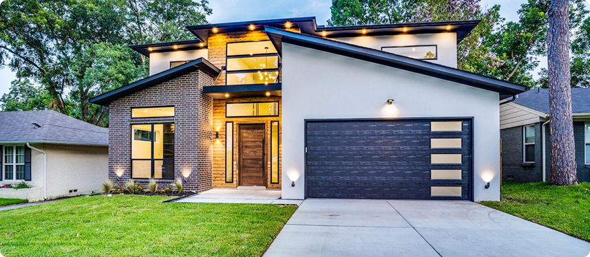 Exterior view of a garage with a driveway, highlighting potential for ADA-compliant garage conversions.