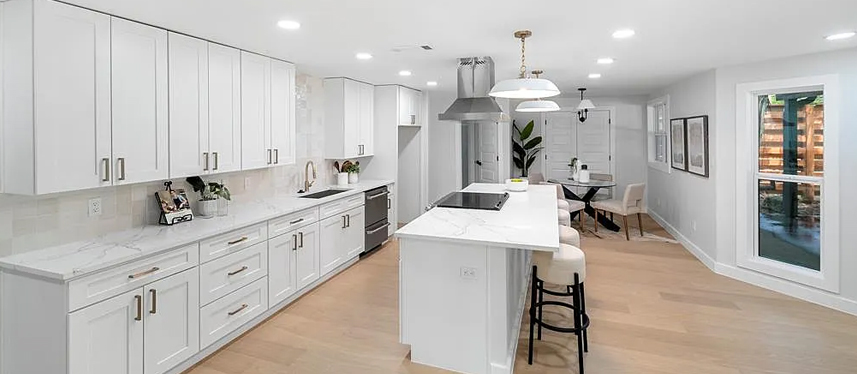 Long kitchen layout with integrated dining area in ADU space