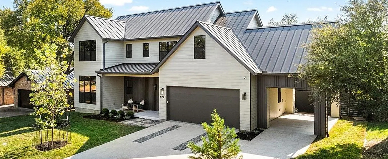 Exterior of a large house with ADU addition and convered garage